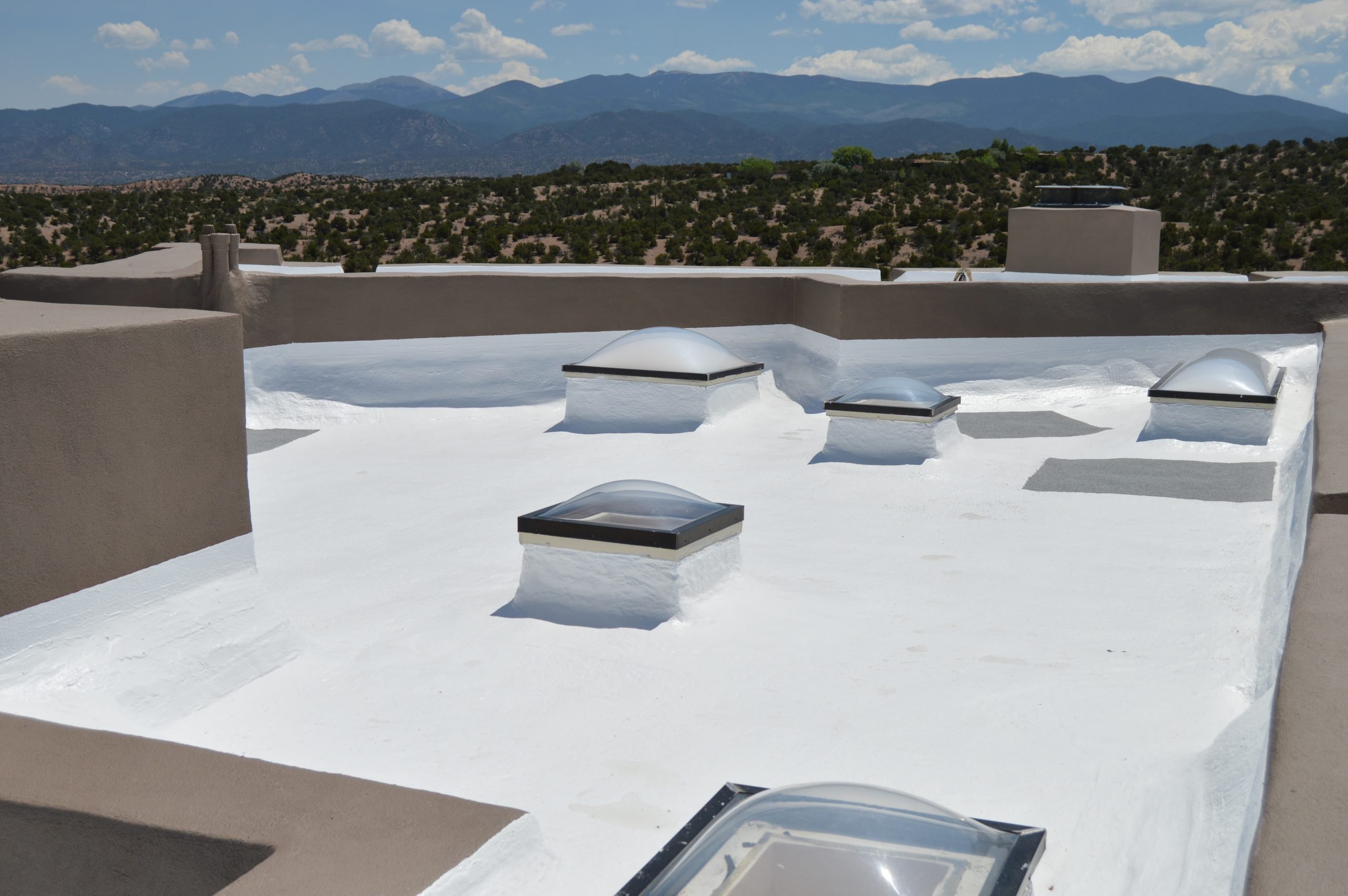 top of a commercial building with multiple skylights, Commercial Roofing Services - Littleton, CO